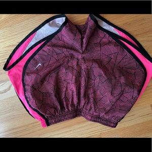 Pink and black Nike shorts